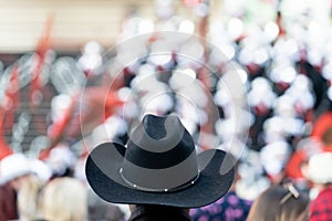 Black Cowboy hat in focus at the Calgary Stampede