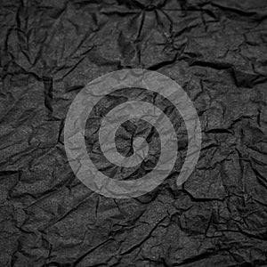 Black crampled paper