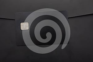Black credit card on black background