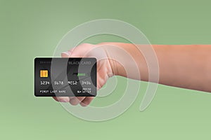 Black credit card in woman hand