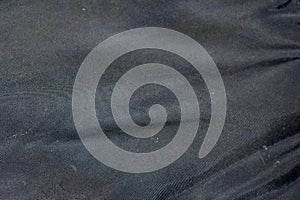Black crinkled fabric texture or background