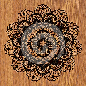 Black crochet doily.