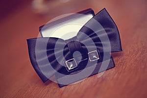 Black cuff links and bowtie