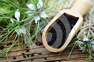 Black cumin nigella sativa or kalonji seeds in spoon