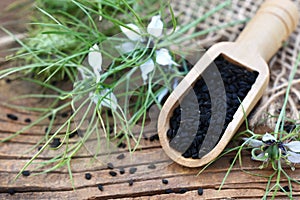 Black cumin nigella sativa or kalonji seeds in spoon