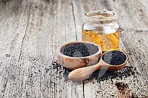 Black cumin oil with seeds photo