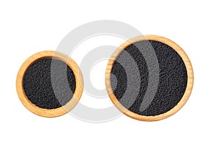 black cumin seed in a wooden bowl  isolated on a white background. top view
