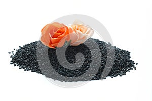 Black cumin seeds isolated on white background. Heap of black nigella seeds. Nigella sativa. Top view.