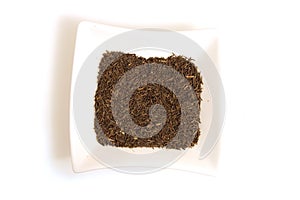 Black cumin seeds in square white bowl