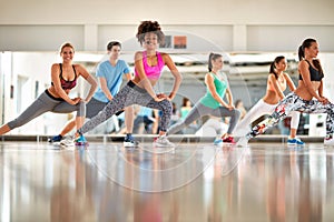 Black curly trainer with group training aerobic