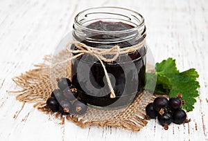 Black currants jam and fresh berries