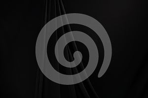 Black Curtain drape wave with studio lighting