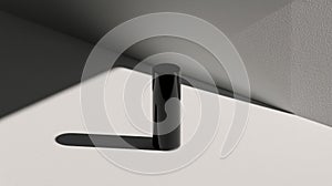 A black cylindrical object casts a shadow on a white surface.