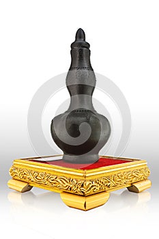 Black decanter on gold platform