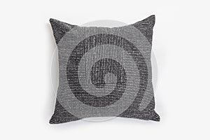 Black decorative pillow isolated on a white background.