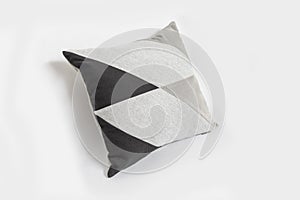 Black decorative pillow isolated on a white background.