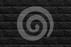 Black decorative wall made of brickwork background texture