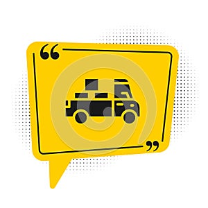 Black Delivery truck with cardboard boxes behind icon isolated on white background. Yellow speech bubble symbol. Vector