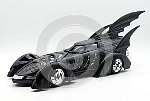 Black diecast Batmobile isolated on white background