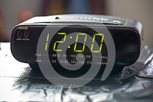 Black digital alarm radio clock.Alarm radio clock indicating time to wake up