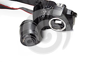 black digital professional camera and lens isolated closeup on white background