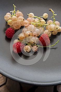 Black dish with freshly  sweet berries