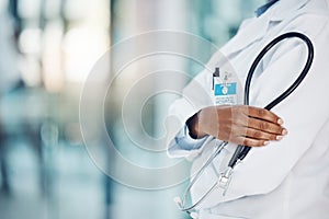 Black doctor hands, stethoscope and healthcare in hospital for medical leadership, wellness and clinic service. Closeup