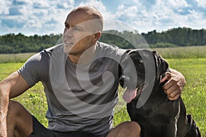 Black dog with boy