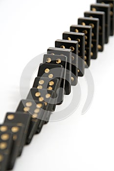 Black Dominoes Falling Down in a Line