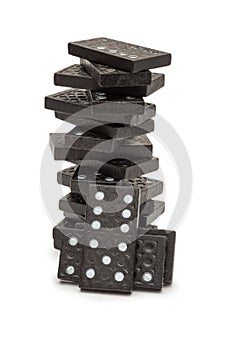 Black dominoes stacked in a tower.