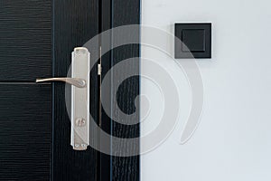 Black door handle and light switch
