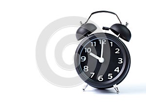 Black double bell alarm clock on white background