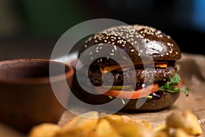 Black double hamburger made from beef, cheese and vegetables-2. photo