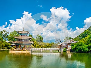 Black Dragon Pool and Moon Embracing Pavilion on sunny day, Lijiang, Yunnan Province, China