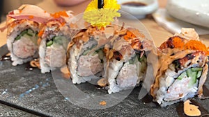 BLACK DRAGON ROLL Crabmeat, Avocado, Kappa Inside with Unagi, Avocado, Fish Flakes and Fish