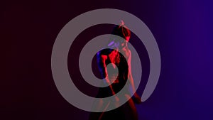 Black dressed and braided hair woman dancehall music style dancing on a blue and red background