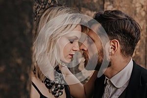 Black dressed wedding couple in rock. In love concept. Newly weds happy couple celebrating love.