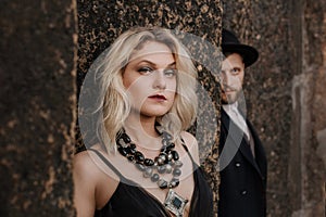 Black dressed wedding couple in rock. In love concept. Newly weds happy couple celebrating love.