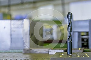 Black drill bit on the work table industria photo