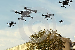 Black drone army flying in the city