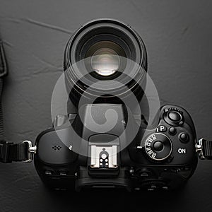 A black DSLR camera is positioned