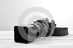 BLACK DSLR Camera with tele lens