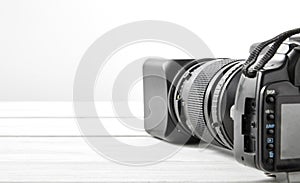 BLACK DSLR Camera with tele lens