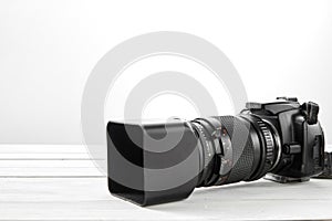 BLACK DSLR Camera with tele lens