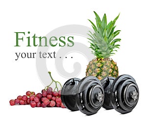 Black dumbbells with pineapple and grapes