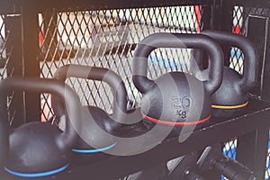 Black dumbbells set. many metal dumbbells on rack in the gym, weight training equipment concept