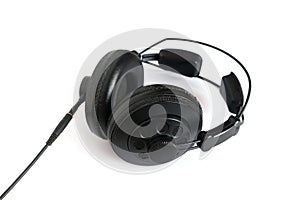 Black dynamic professional stereo headphones studio photo  isolated on white closeup