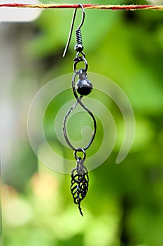 Black ear ring acts as a ornament to the nature
