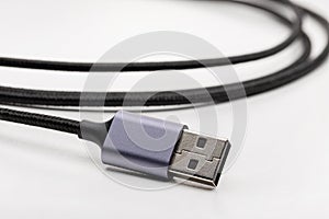 Black elastic cable with plug for electronics.