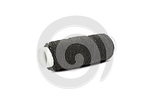 Black elastic thread on the coil horizontally isolated on white
